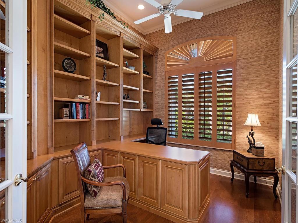 7347 Stonegate Drive Naples, FL 34109 - Photo 13 of 20 a dining room with furniture and wooden floor