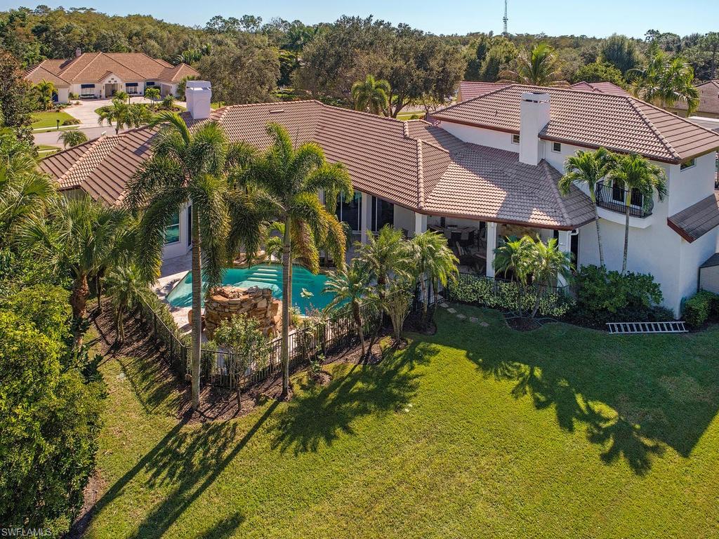 7347 Stonegate Drive Naples, FL 34109 - Photo 17 of 20 a view of a house with a yard