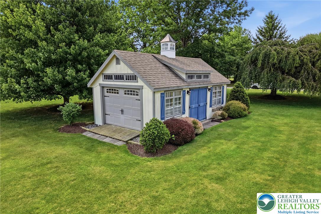 1795 Freier Road Quakertown, PA 18951 - Photo 56 of 69 A charming outbuilding with a cupola nestled amidst a well-maintained lawn.