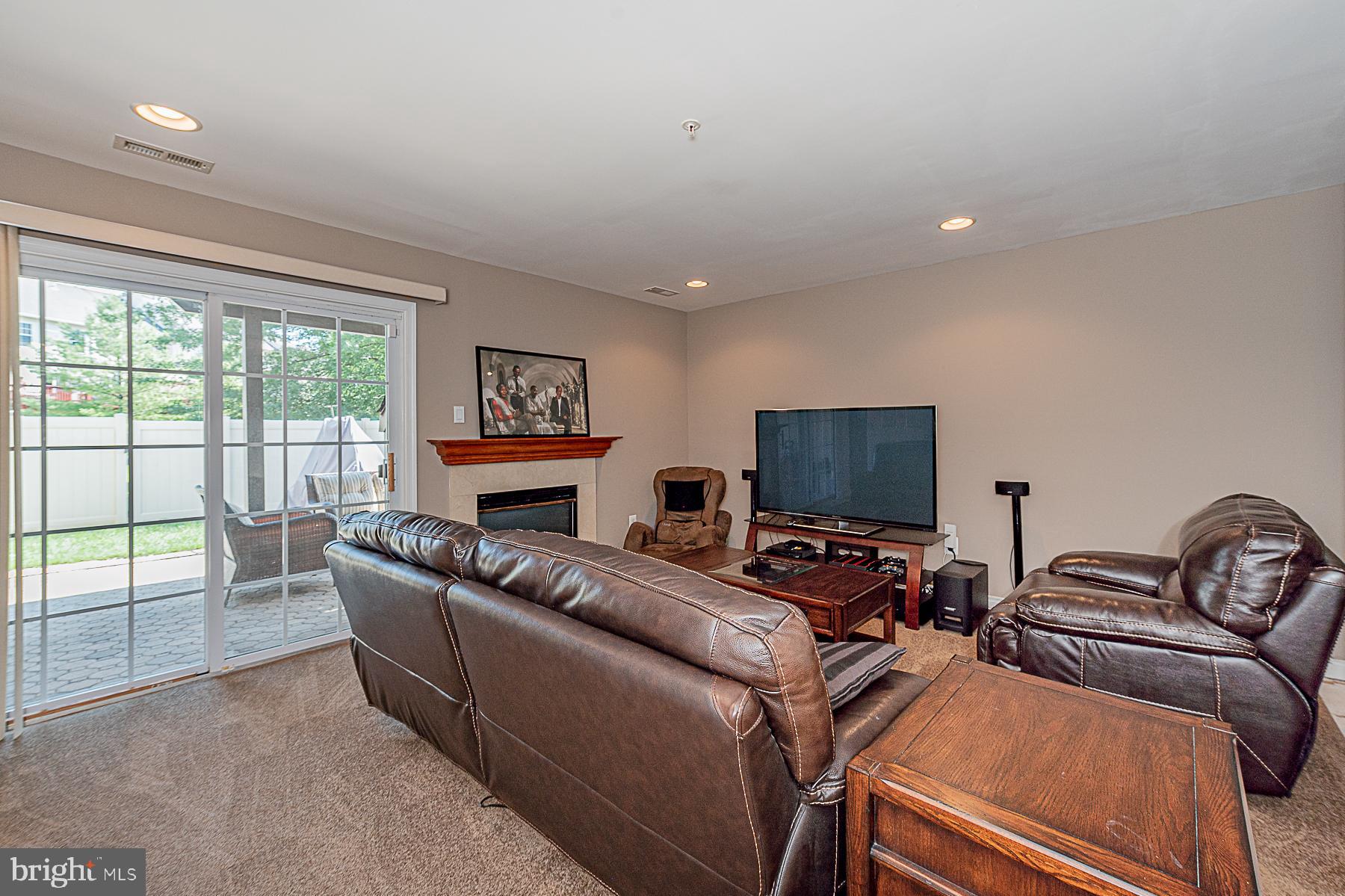 9526 Branchleigh Road Randallstown, MD 21133 - Photo 7 of 44 Finished Lower Level w/cozy fireplace