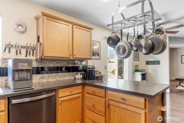 a kitchen with a sink cabinets and window