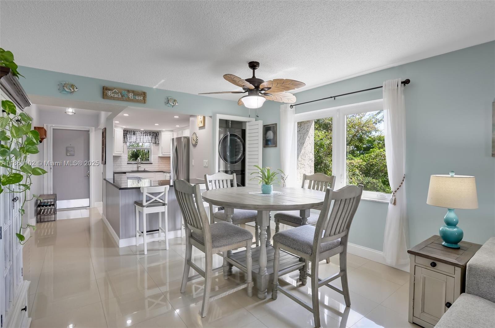 6020 Northwest 44th Street, Unit 401 Lauderhill, FL 33319 - Photo 21 of 35 a view of a dining room with furniture window and outside view