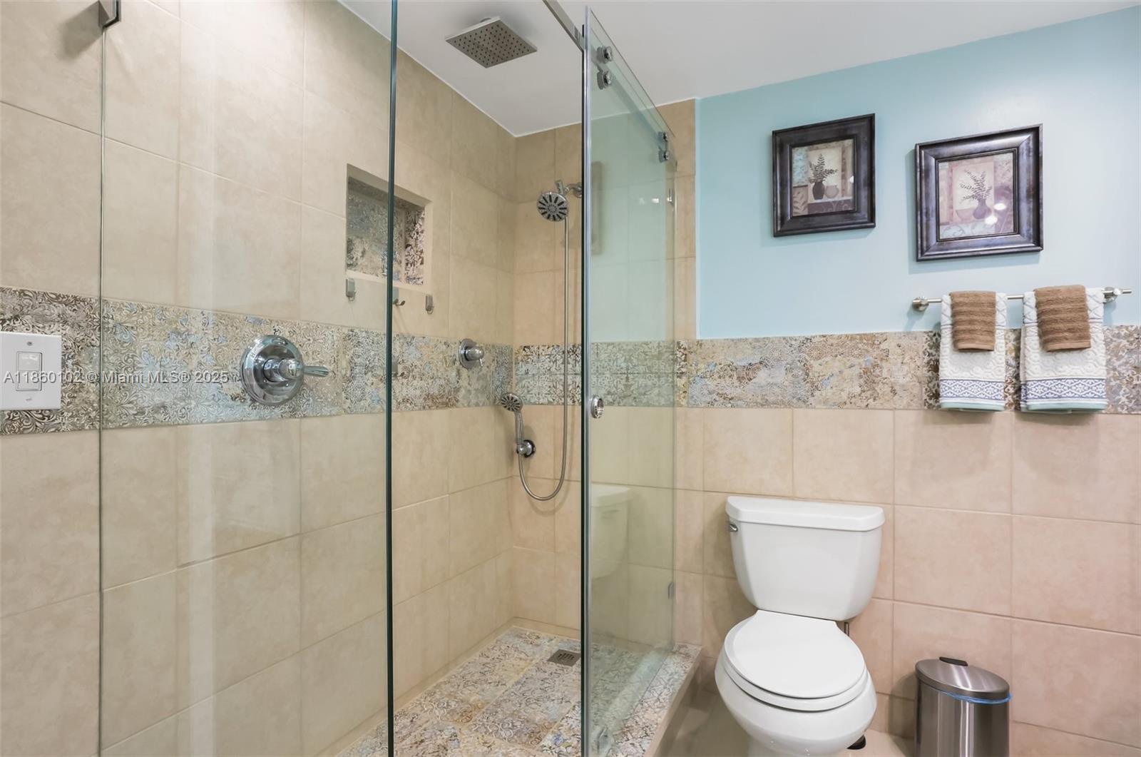 6020 Northwest 44th Street, Unit 401 Lauderhill, FL 33319 - Photo 26 of 35 a bathroom with a toilet and a shower