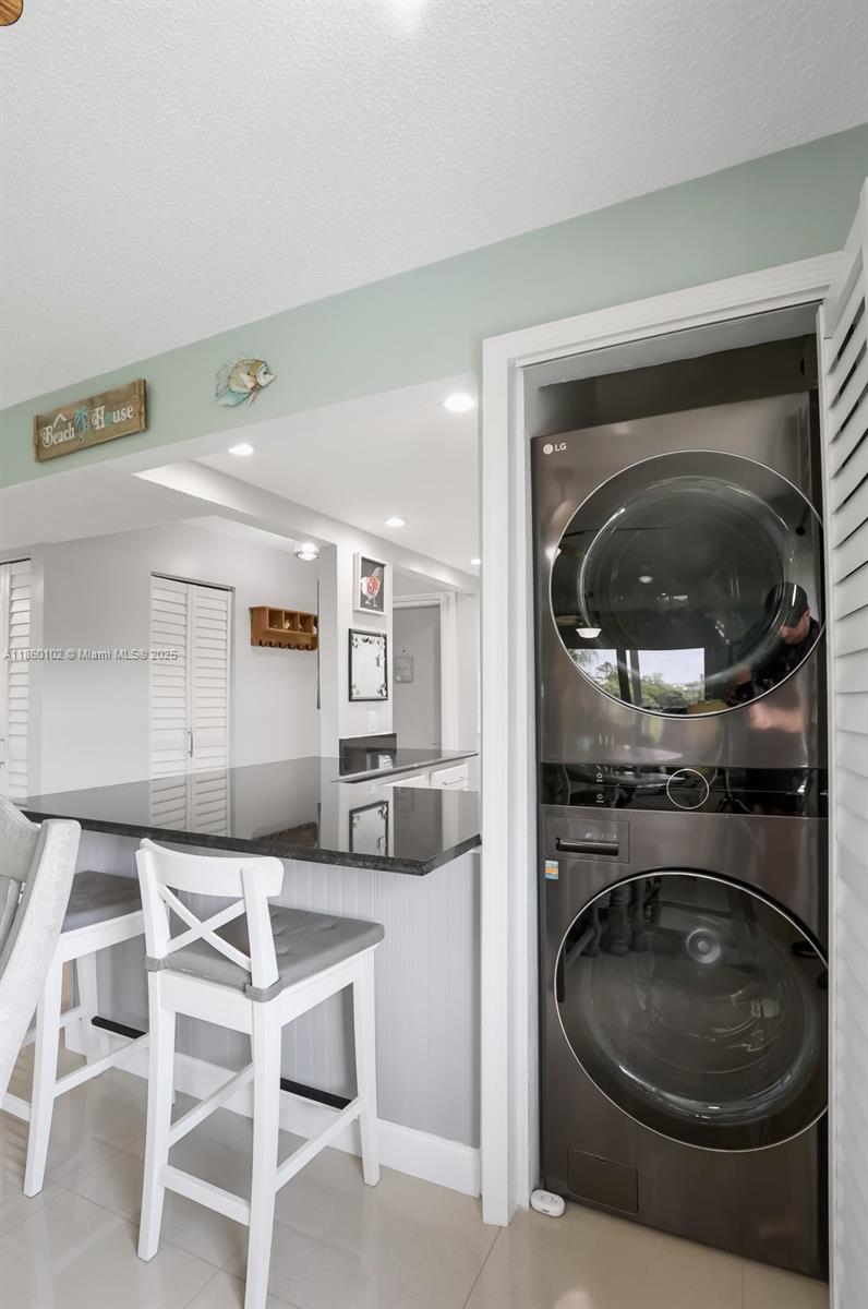 6020 Northwest 44th Street, Unit 401 Lauderhill, FL 33319 - Photo 30 of 35 a kitchen with a sink and a stove top oven