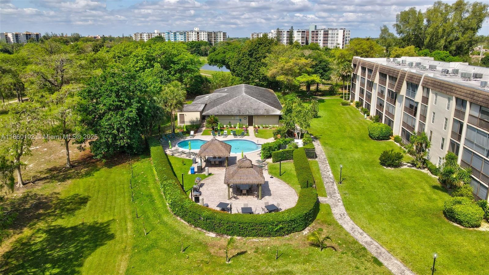 6020 Northwest 44th Street, Unit 401 Lauderhill, FL 33319 - Photo 31 of 35 a view of a garden with a fountain