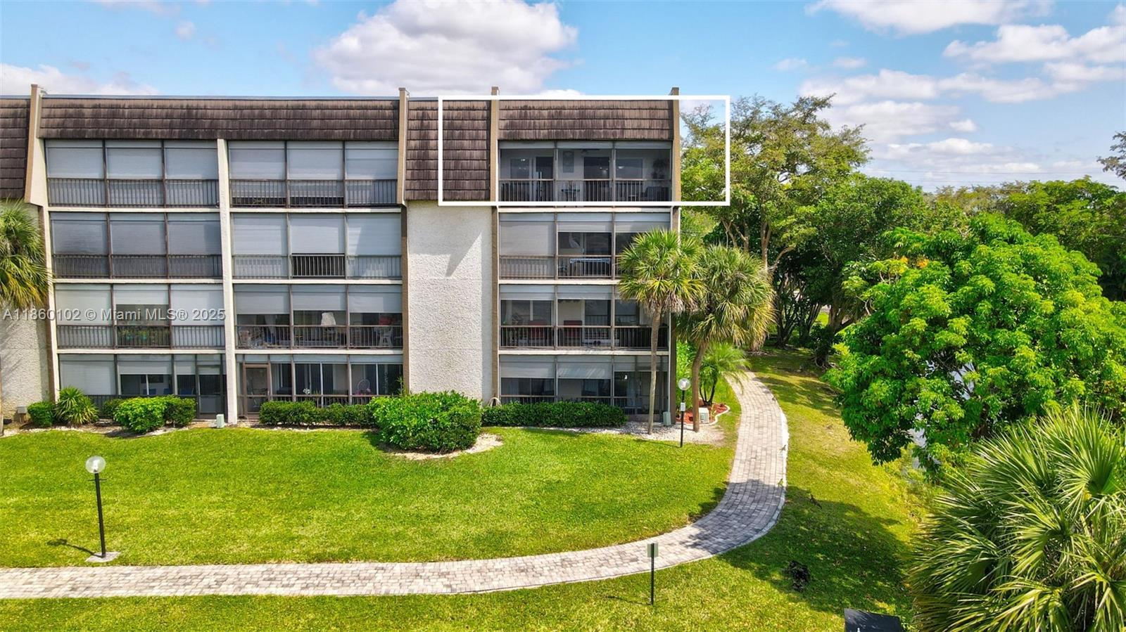 6020 Northwest 44th Street, Unit 401 Lauderhill, FL 33319 - Photo 34 of 35 a view of a backyard