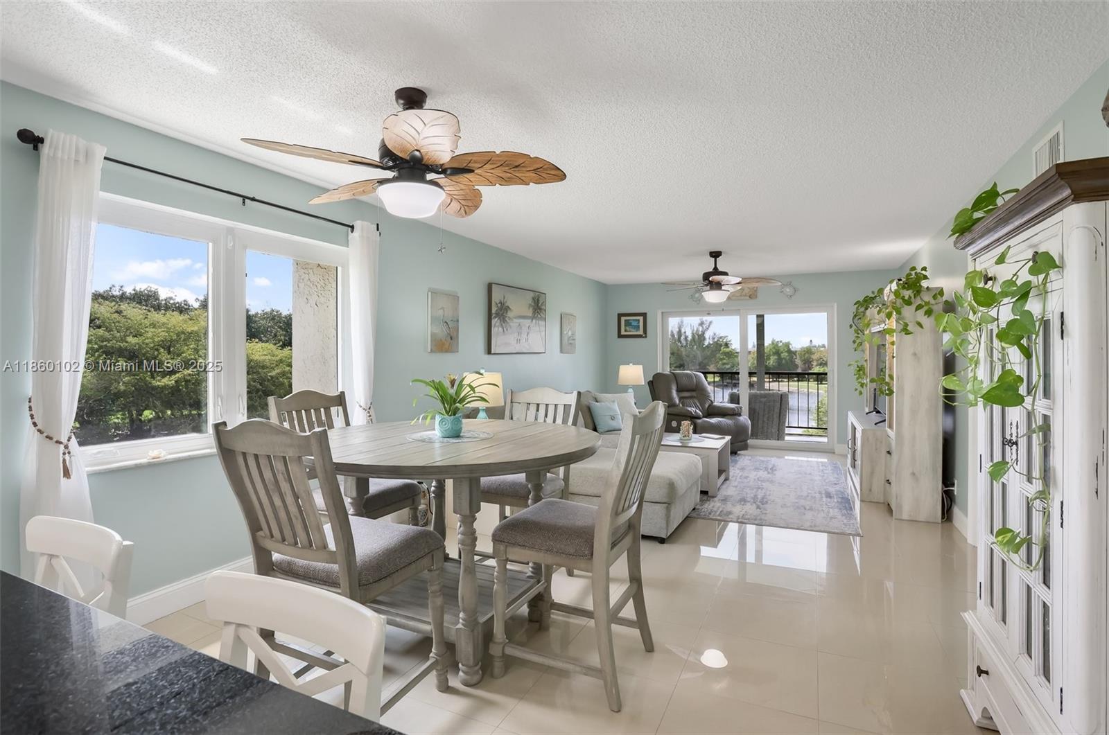 6020 Northwest 44th Street, Unit 401 Lauderhill, FL 33319 - Photo 6 of 35 a view of a dining room with furniture window and outside view