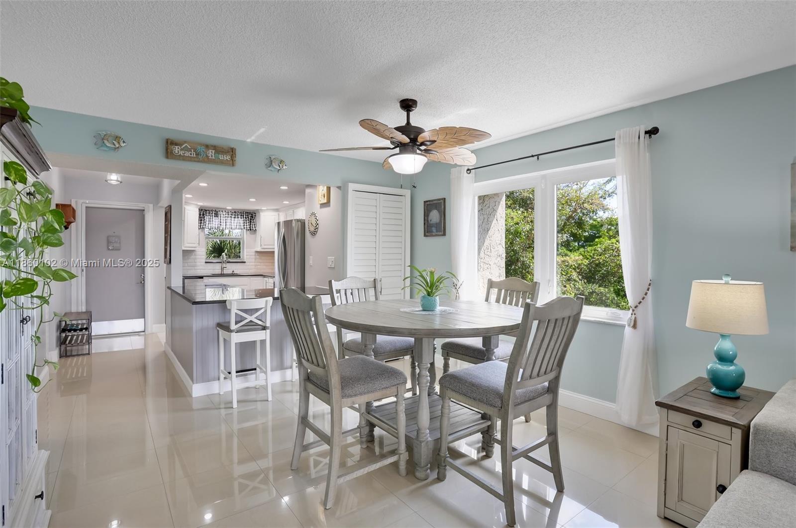 6020 Northwest 44th Street, Unit 401 Lauderhill, FL 33319 - Photo 7 of 35 a view of a dining room with furniture window and outside view