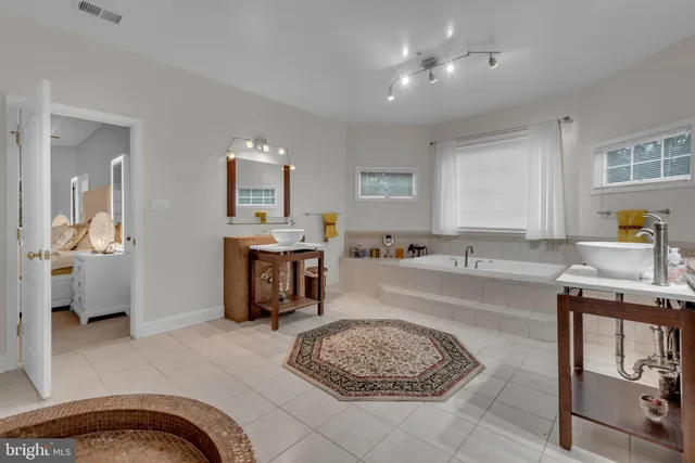 a car parked in front of a house with a yard