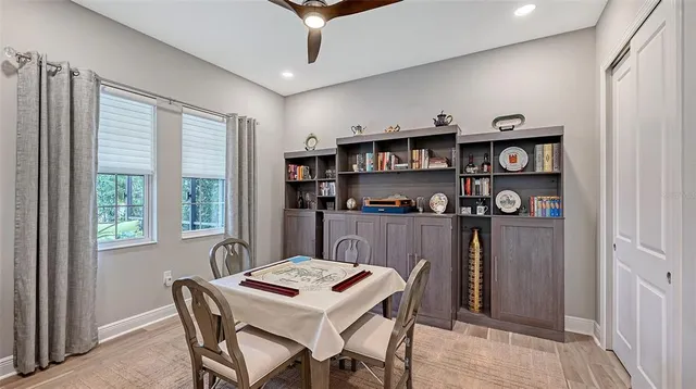 an aerial view of a city with lots of residential buildings ocean and mountain view in back