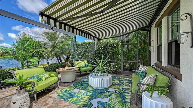 a view of a swimming pool with a table and chairs