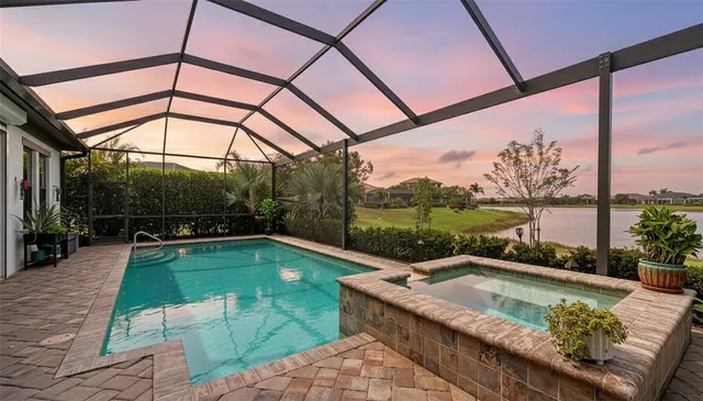 a view of a swimming pool and lounge chairs