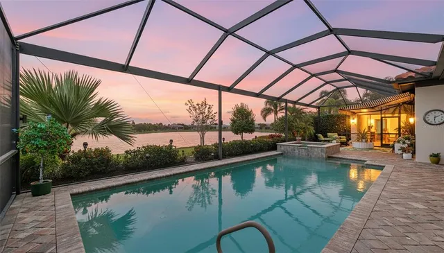 a view of outdoor space with swimming pool and lounge chair