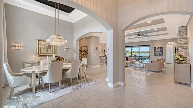 a living room with furniture a chandelier and a chandelier