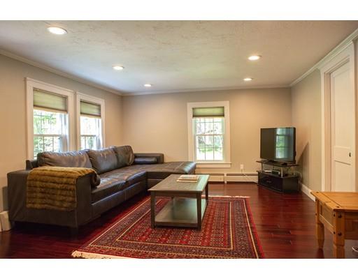 130 Middleton Road Boxford, MA 01921 - Photo 3 of 19 a living room with furniture a flat screen tv and a window