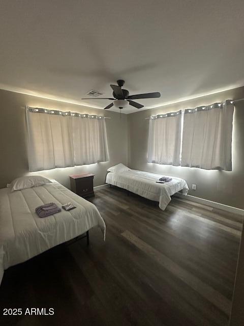 1908 South 14th Street Phoenix, AZ 85034 - Photo 12 of 18 a bedroom with two beds and a ceiling fan