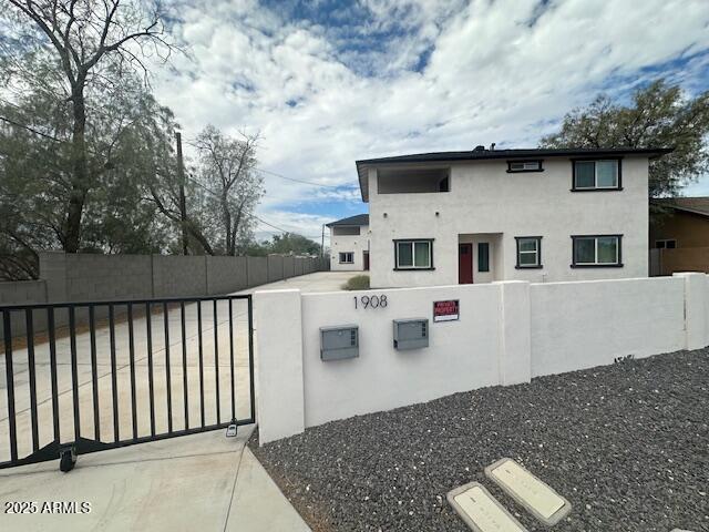 1908 South 14th Street Phoenix, AZ 85034 - Photo 2 of 18 a front view of a house with balcony