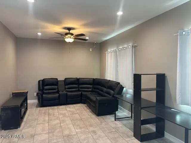 a hallway with a large mirror and a refrigerator