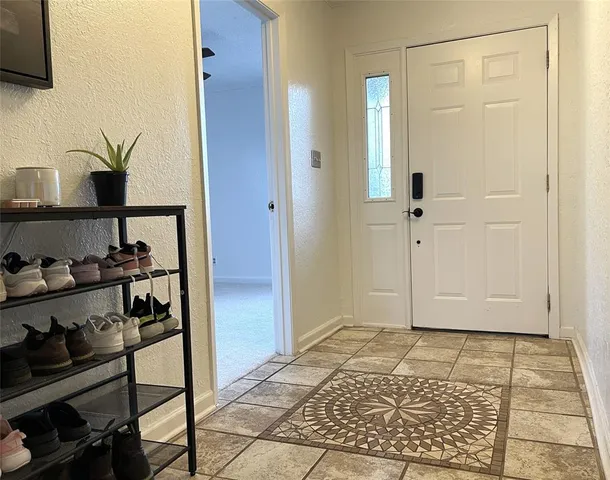 a view of entryway with wooden floor