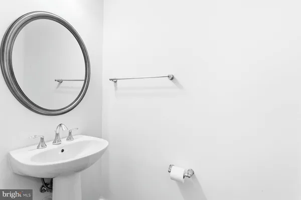 a bathroom with a sink a mirror and a shower