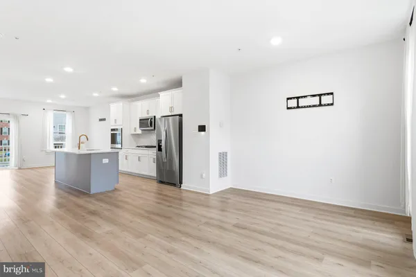 a view of kitchen with wooden floor