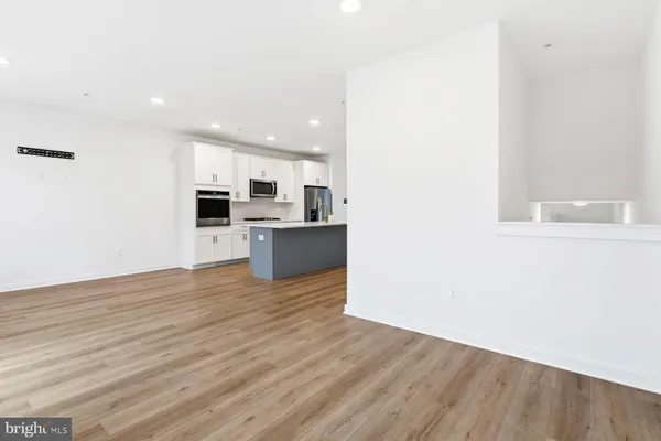 a view of kitchen with wooden floor