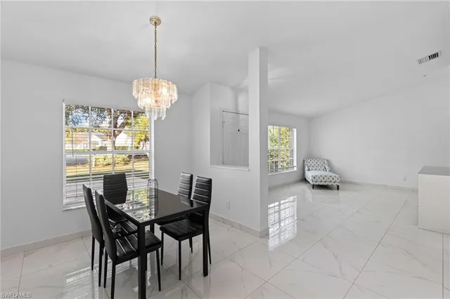 a kitchen with cabinets stainless steel appliances and a counter space