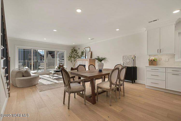 24 Surf Street Sea Bright, NJ 07760 - Photo 8 of 51 a view of a dining room with furniture and wooden floor