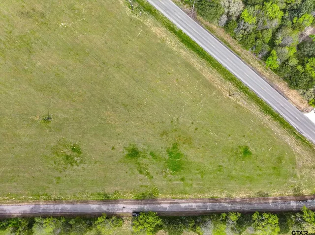 a view of balcony with wooden floor