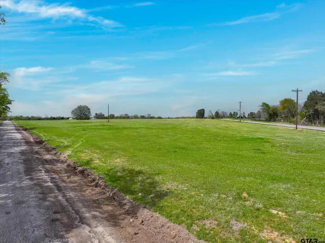 a view of a big yard with an outdoor space