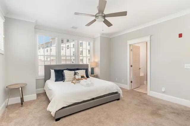 a bedroom with a bed and a table