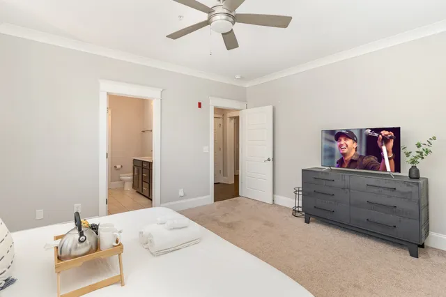 a bedroom with furniture and a dresser
