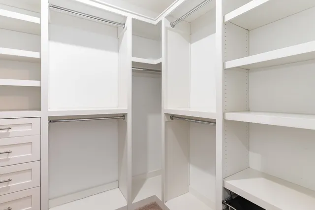a view of an empty walk in closet