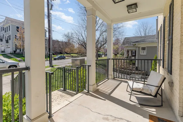 a view of a balcony with furniture