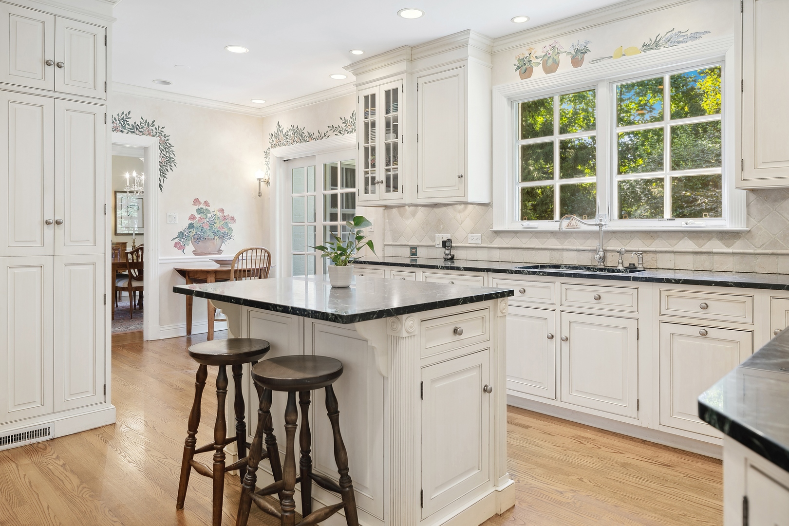 1035 Pawnee Road Wilmette, IL 60091 - Photo 12 of 26 a kitchen with stainless steel appliances granite countertop a stove a sink and a microwave