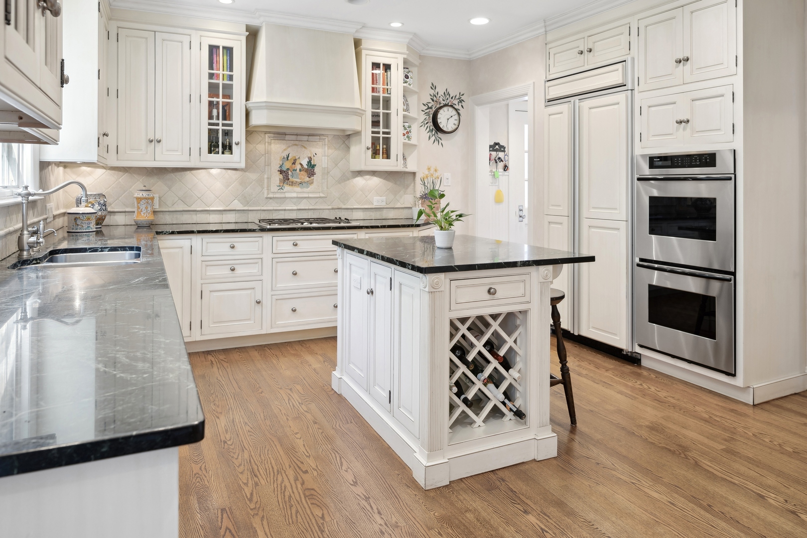 1035 Pawnee Road Wilmette, IL 60091 - Photo 13 of 26 a kitchen with stainless steel appliances a stove a sink and a refrigerator