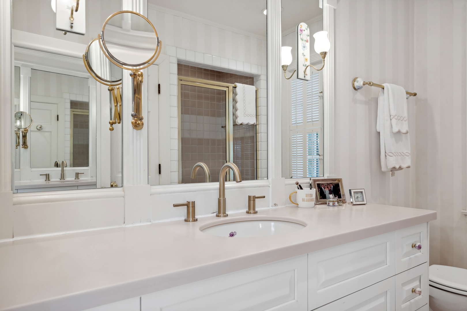 1035 Pawnee Road Wilmette, IL 60091 - Photo 16 of 26 a bathroom with a sink and a mirror with bathtub