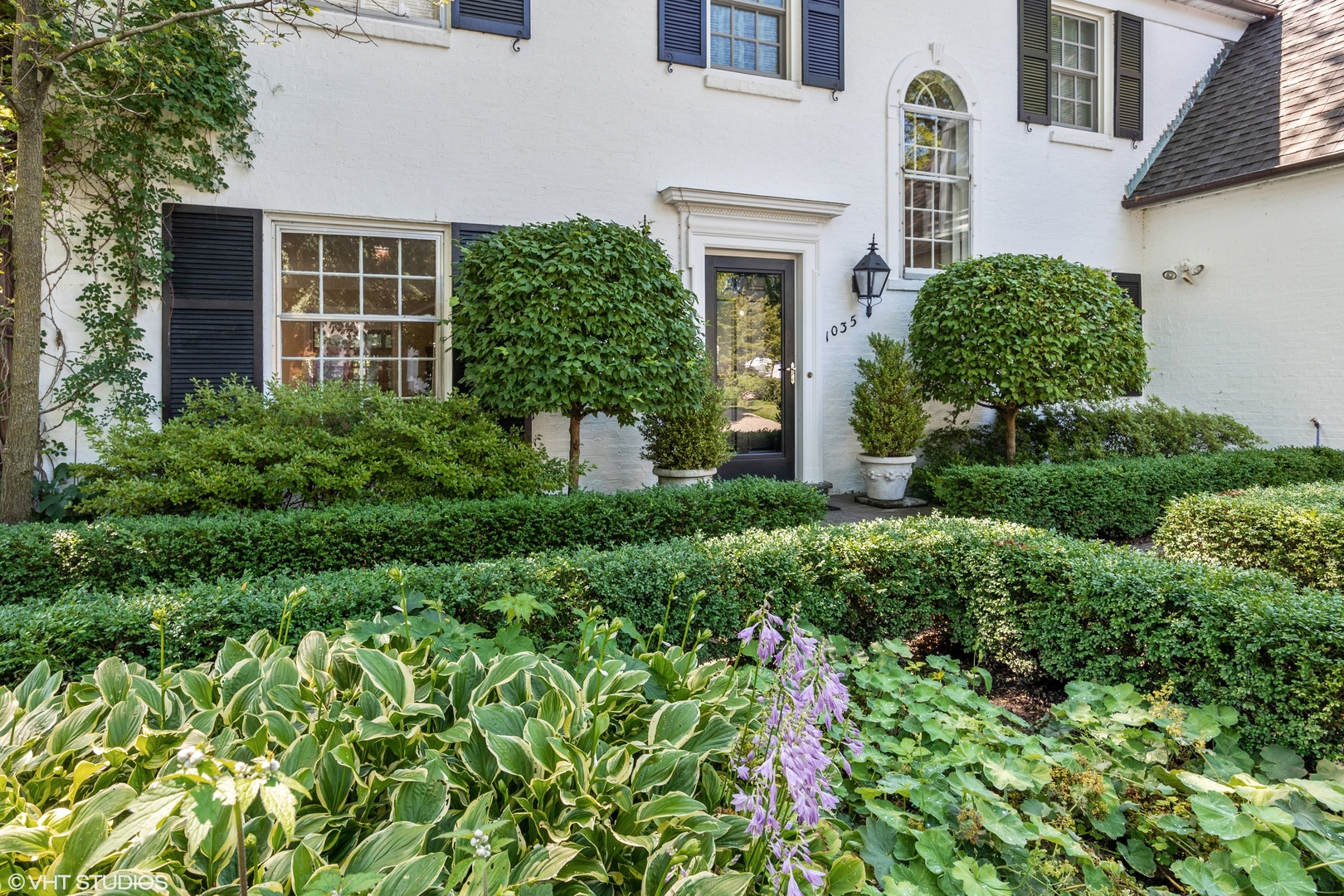 1035 Pawnee Road Wilmette, IL 60091 - Photo 2 of 26 front view of a house with a yard