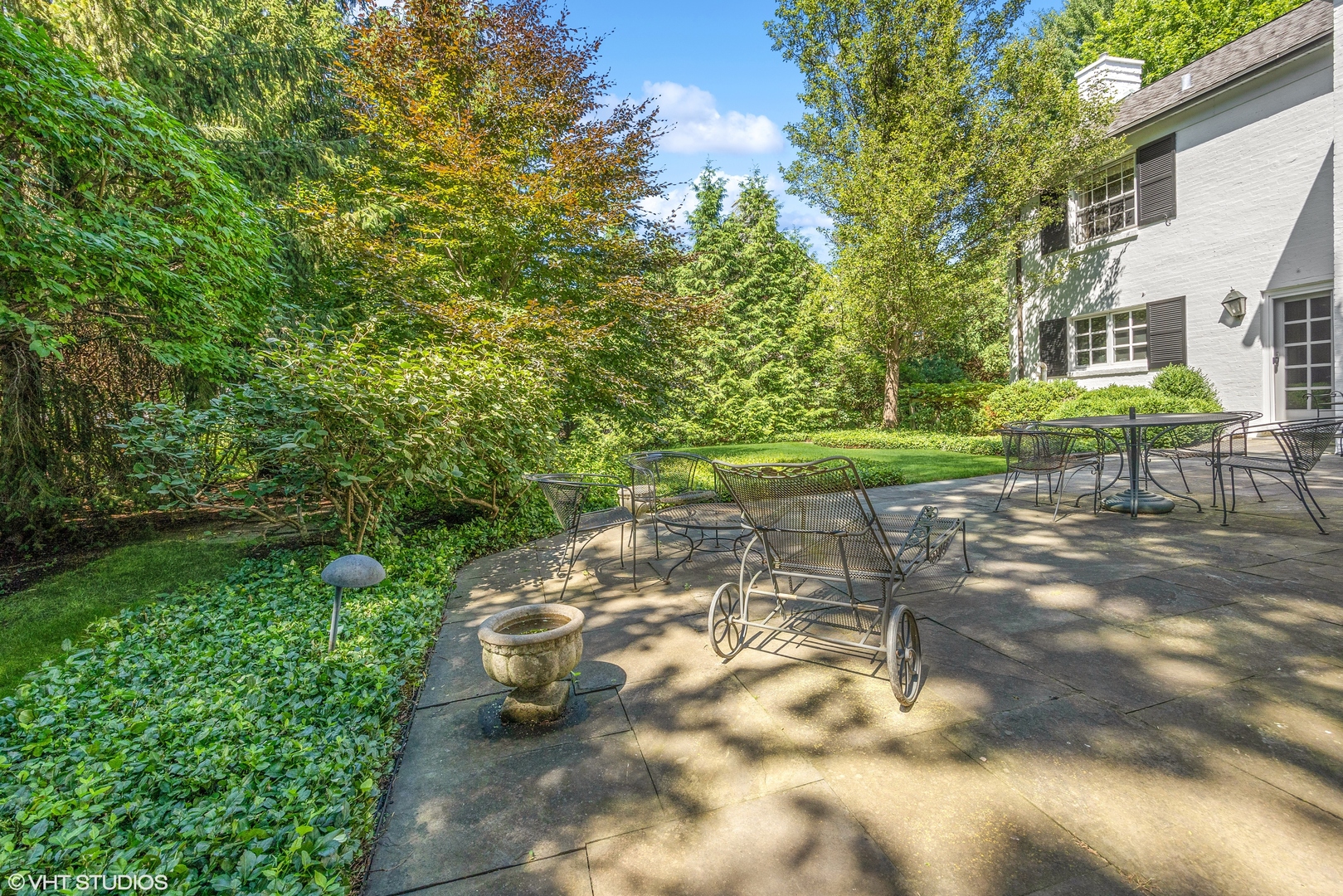1035 Pawnee Road Wilmette, IL 60091 - Photo 21 of 26 a view of a table and chairs in the garden