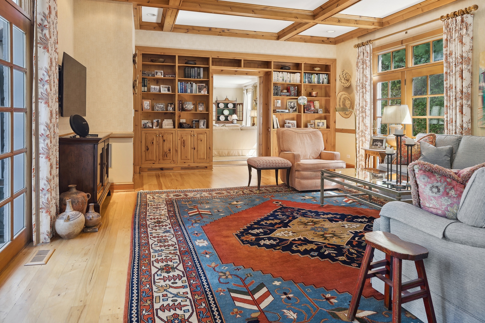 1035 Pawnee Road Wilmette, IL 60091 - Photo 8 of 26 a living room with furniture rug and wooden floor