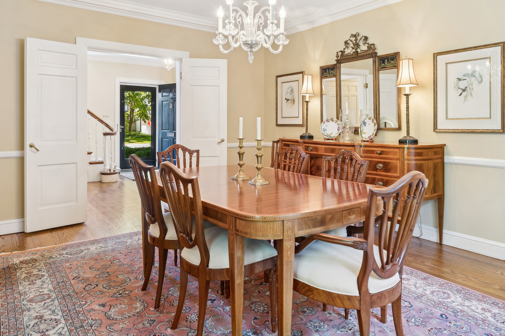 1035 Pawnee Road Wilmette, IL 60091 - Photo 10 of 26 a view of a dining room with furniture and chandelier