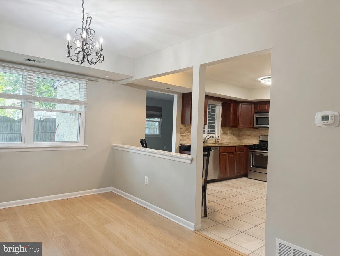 2 Goshawk Court Voorhees, NJ 08043 - Photo 7 of 33 a view of a kitchen with a sink and microwave