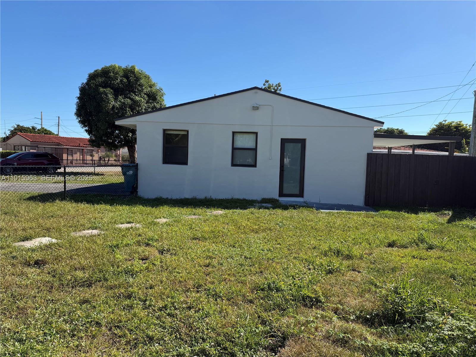 7330 Southwest 11th Street, Unit EFFICIENCY Miami, FL 33144 - Photo 12 of 12 a house with garden in front of it