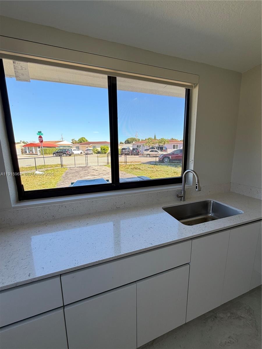 7330 Southwest 11th Street, Unit EFFICIENCY Miami, FL 33144 - Photo 7 of 11 a view of a room with a large window