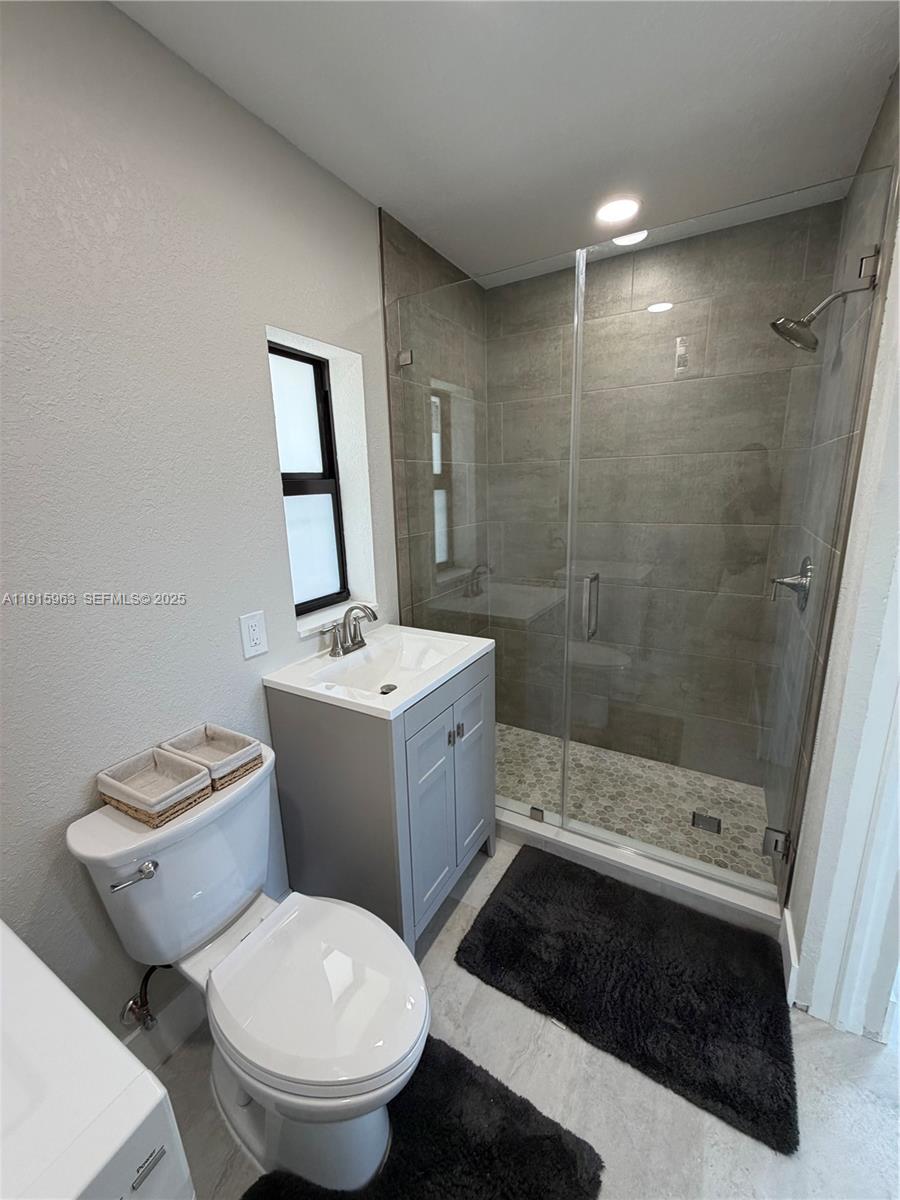 7330 Southwest 11th Street, Unit EFFICIENCY Miami, FL 33144 - Photo 9 of 11 a bathroom with a sink toilet and shower