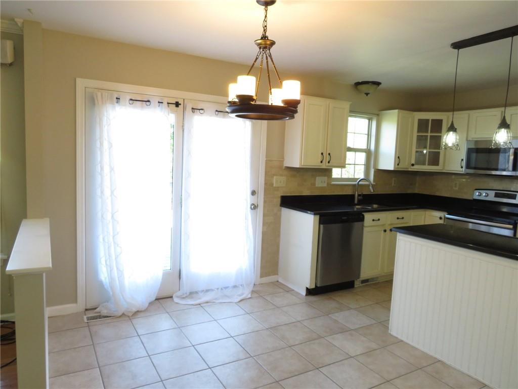 6755 Old Mars Crider Road Seven Fields, PA 16046 - Photo 11 of 50 a kitchen with a sink a counter top space and cabinets