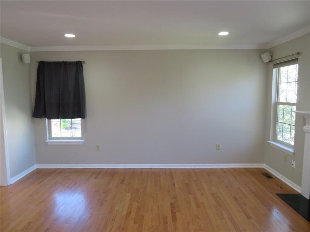 6755 Old Mars Crider Road Seven Fields, PA 16046 - Photo 12 of 50 an empty room with wooden floor and windows