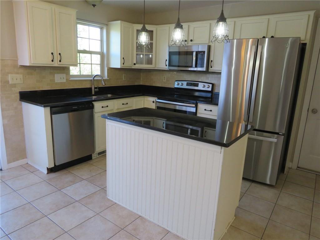 6755 Old Mars Crider Road Seven Fields, PA 16046 - Photo 16 of 50 a kitchen with a refrigerator sink and microwave