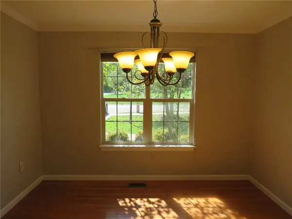 a room with window lake and mountain view