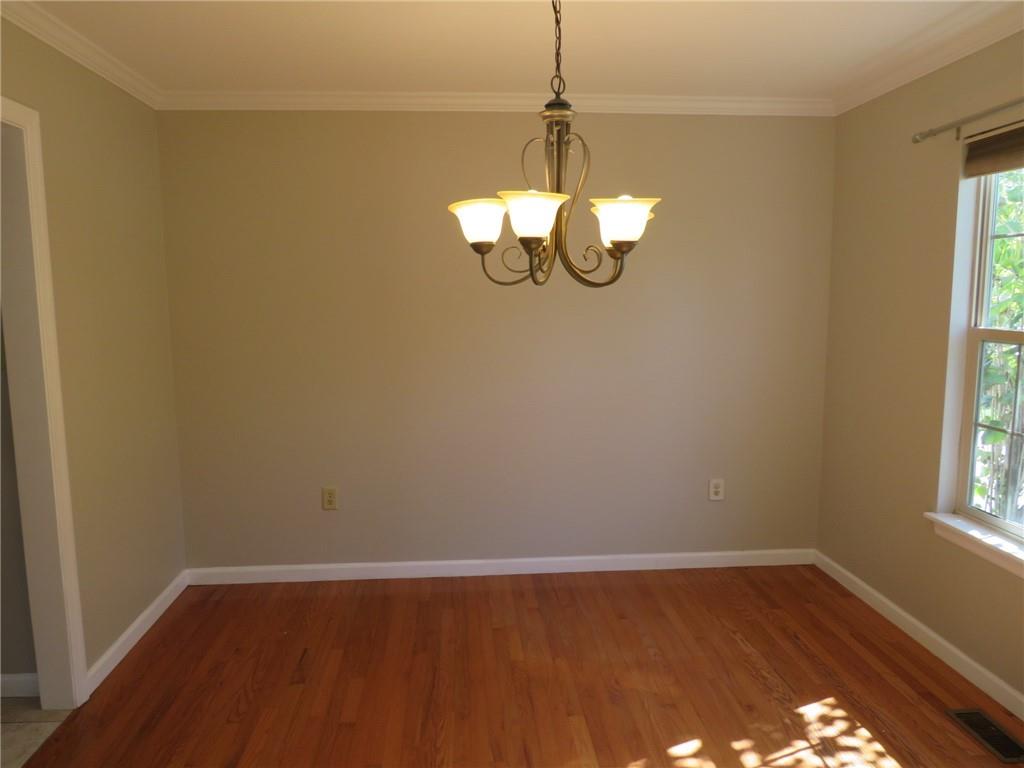 6755 Old Mars Crider Road Seven Fields, PA 16046 - Photo 21 of 50 a view of a room with wooden floor chandelier and window